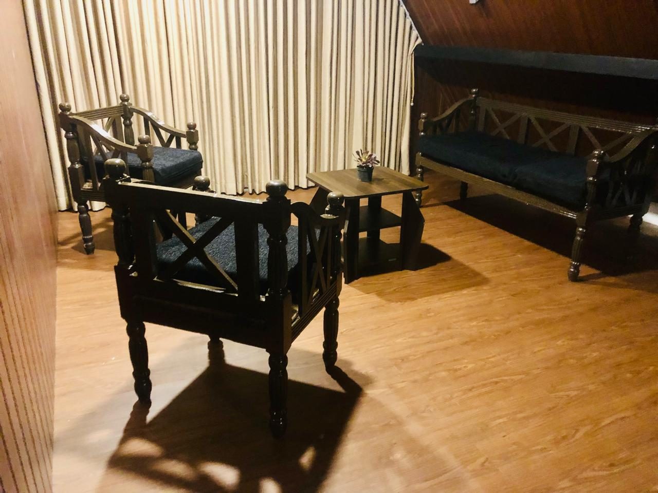 Sitting area with wooden chairs